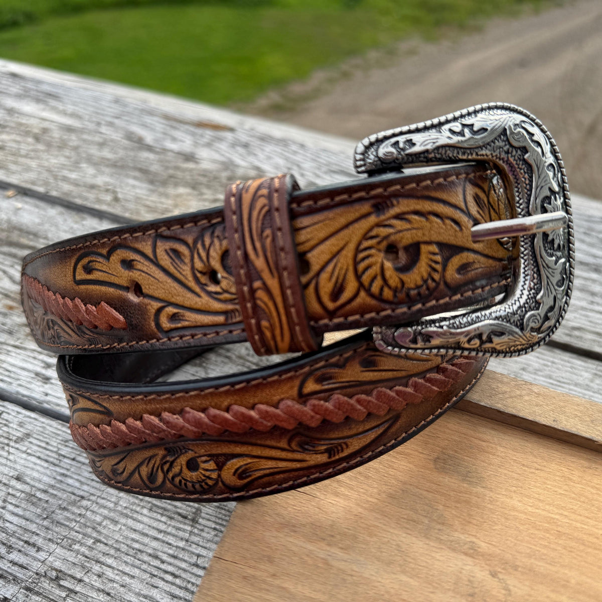 Men's tooled leather Western belt available at Veloura Menswear